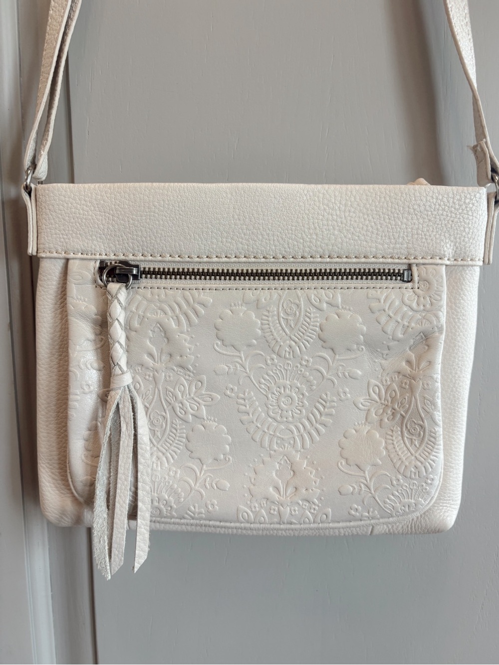 The Sak Sanibel White Floral Boho Embossed Leather Crossbody w Tassel - Cream